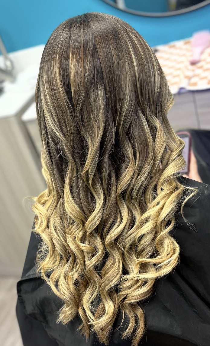 Brunette to blonde ombre with spiral curls